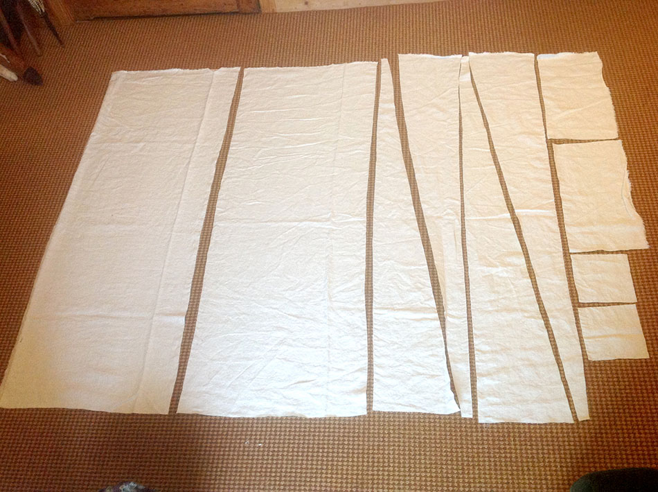 The pieces of the shift, showing how they could be cut from just 68” of 55" wide fabric. despite being cut at a larger size than the original instructions. The body pieces are on the left, sleeves and underarm gussets on the right, and the triangular side gores in between. 