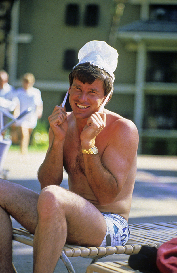 Golfer Nick Faldo poses for the camera wearing his daughter Natalie's bonnet at the Kapalua International Golf Championship  (Photograph © Lawrence Levy Photographic Collection. All rights reserved.  Image courtesy of the University of St Andrews Library, [2008-1-7370]
