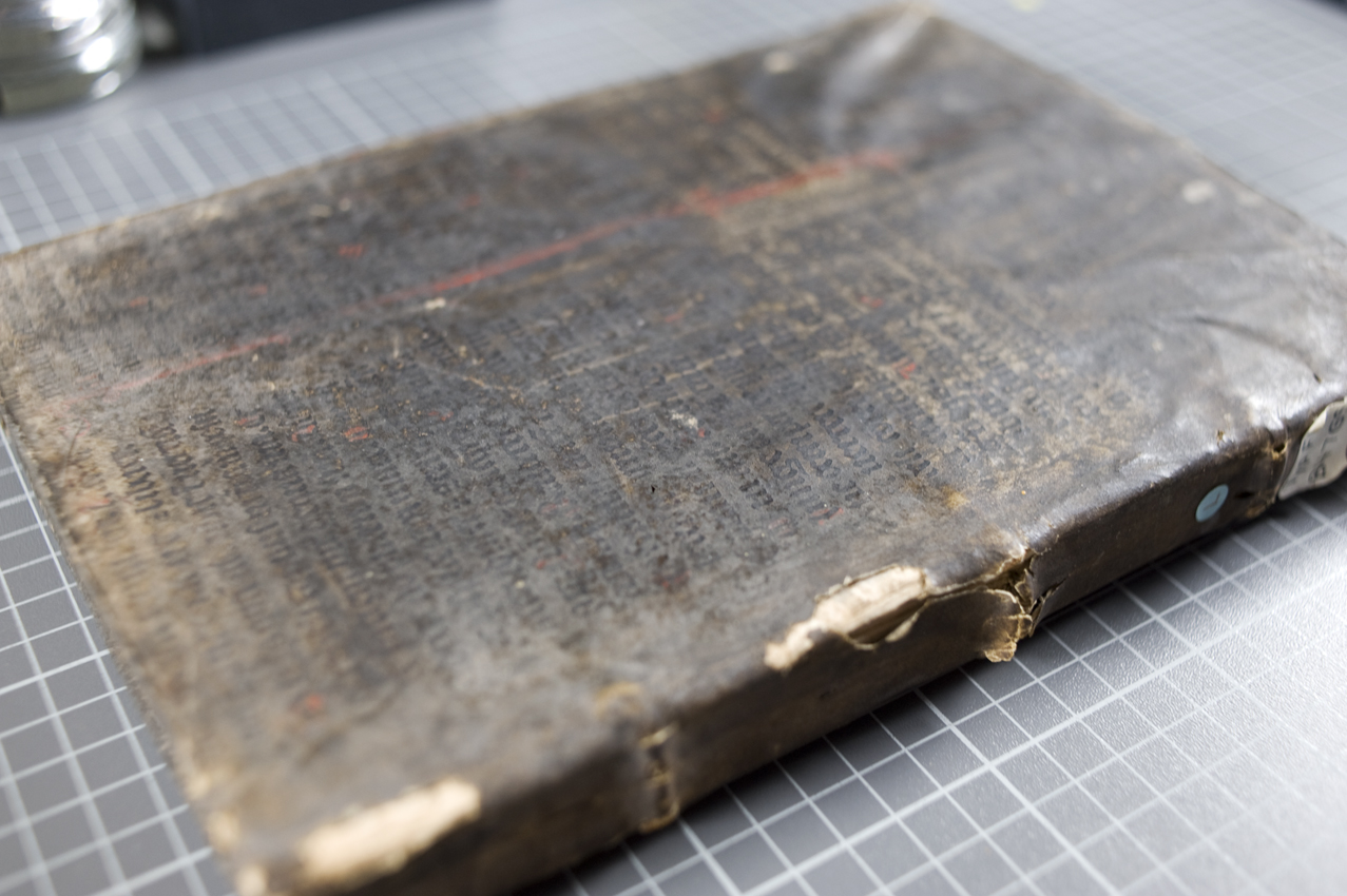 The front cover of TypFL.B47GS, bound in a leaf of a 15th century manuscript Bible which has been washed black, written in gothic textualis script, and comprising part of 1 Kings, chapter 18.