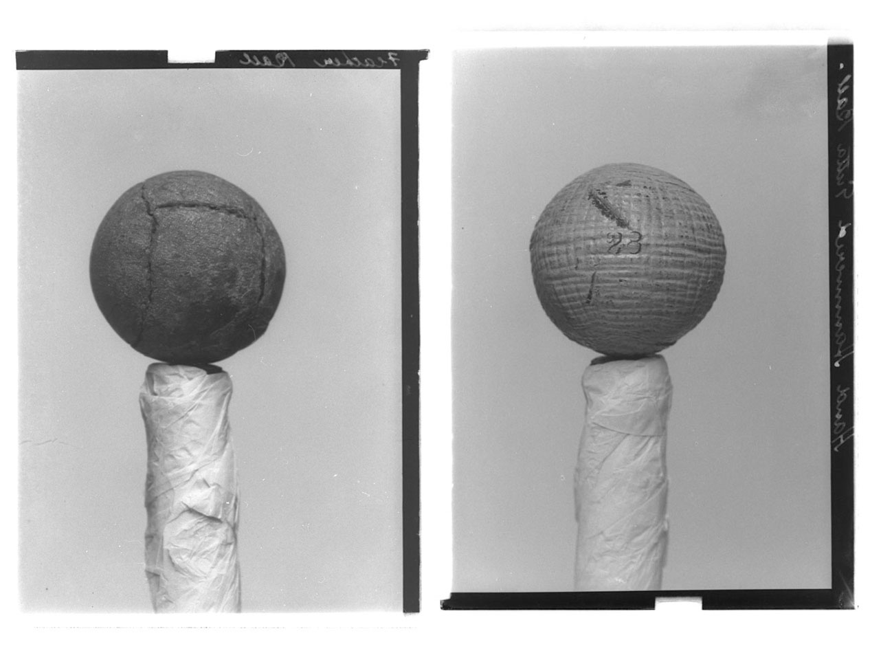 Left: Gelatin dry plate negative (glass plate) of a feather golf ball, by John Fairweather, 1900 (GMC-F-213). Right: Gelatin dry plate negative of a hand hammered guttie golf ball, by John Fairweather, 1900 (GMC-F-210).