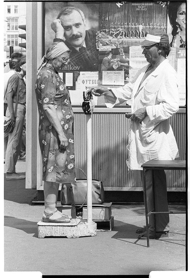 Figure legend: Soviet woman using some scales, by Franki Raffles, 1989 [link to image]. ©Franki Raffles Estate