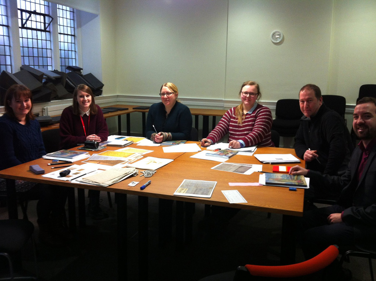 Anabel and her fellow trainees enjoying a palaeography taster session on the cohort visit to St Andrews