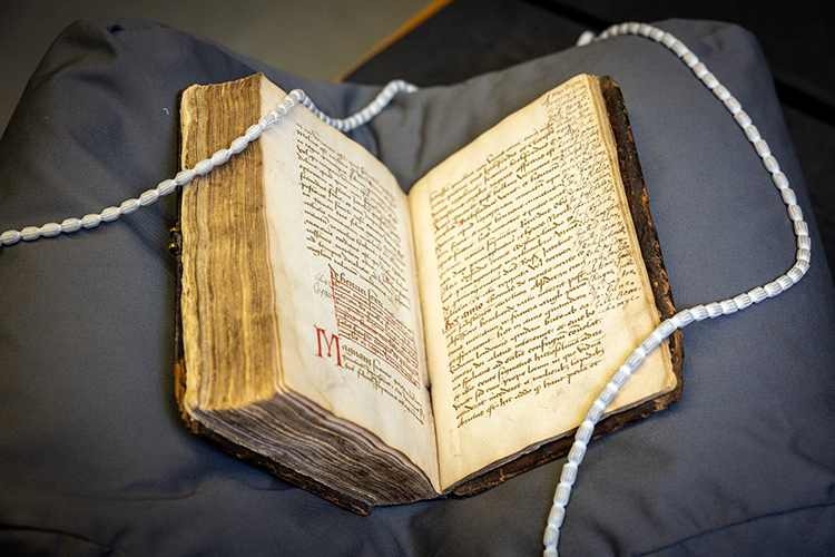 Image of a book with handwritten text